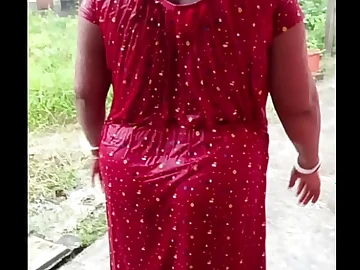 Big-titted Chinese hottie DasX R gets soaked in the rain while flashing off her curvaceous assets